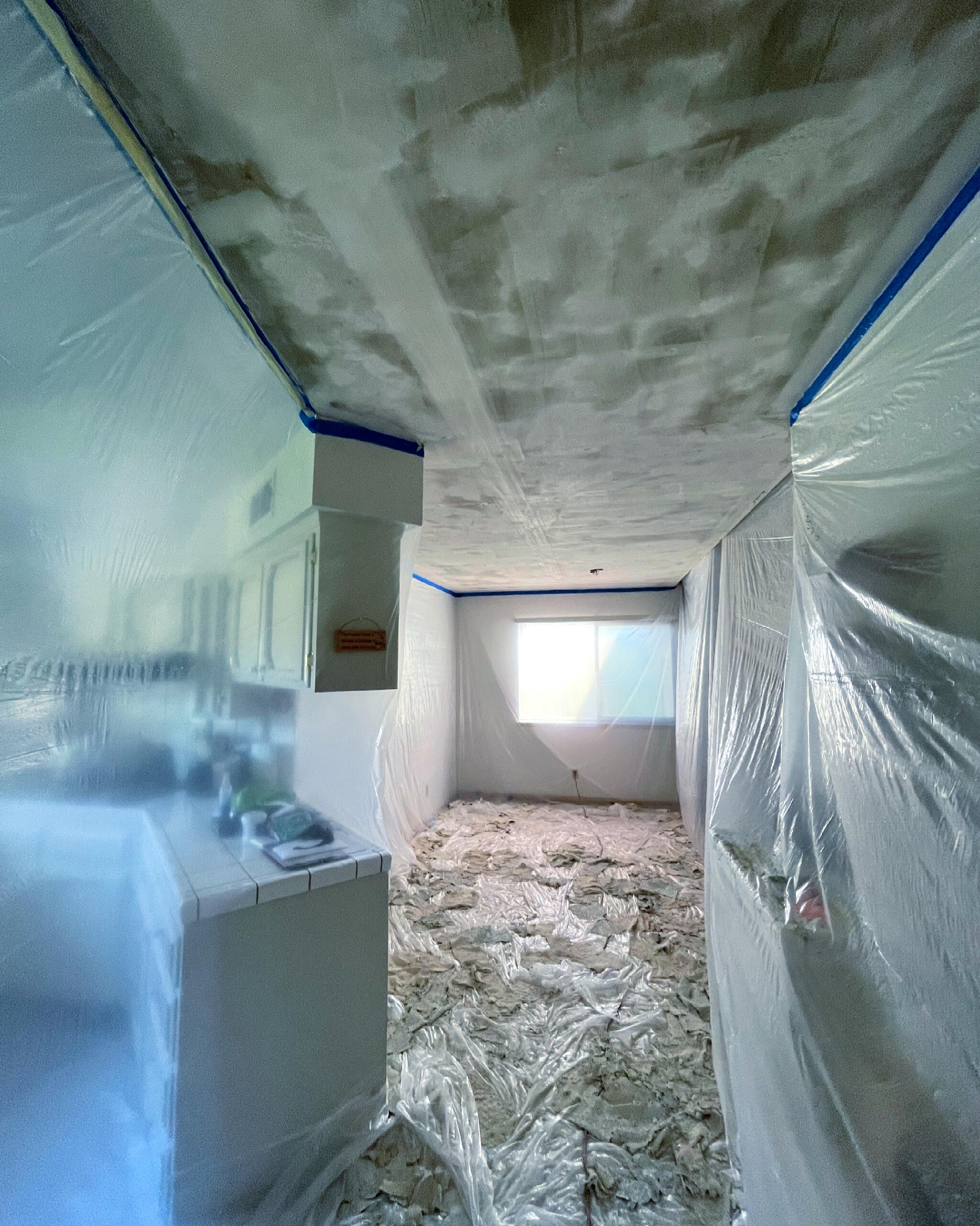 Clovis popcorn ceiling removal in progress